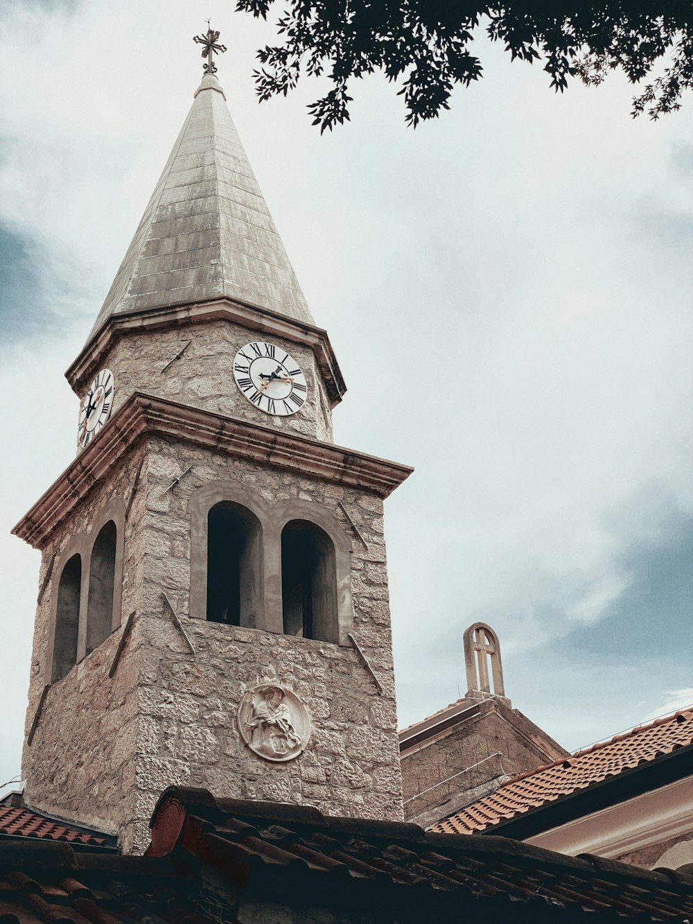 brown concrete building under white clouds during daytime