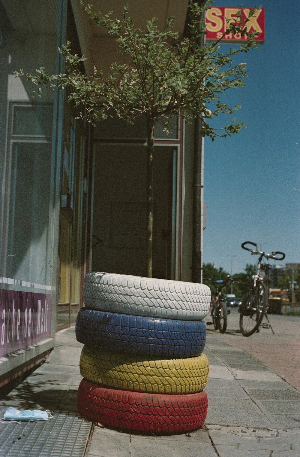 black bicycle parked beside blue and white round bed