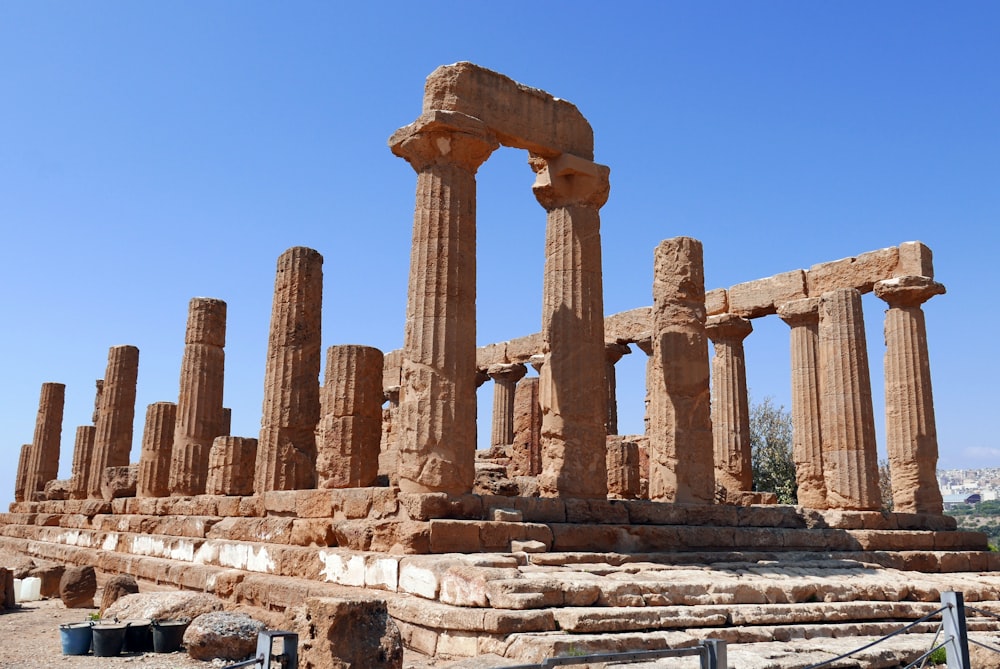 brown concrete pillars under blue sky during daytime