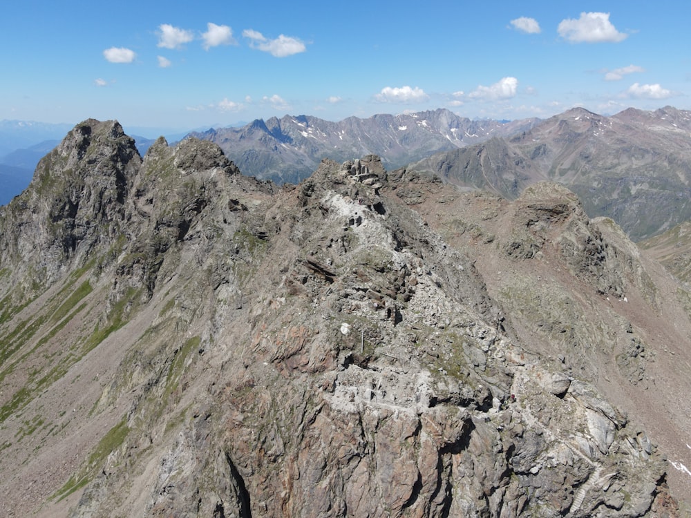 gray rocky mountain under blue sky during daytime