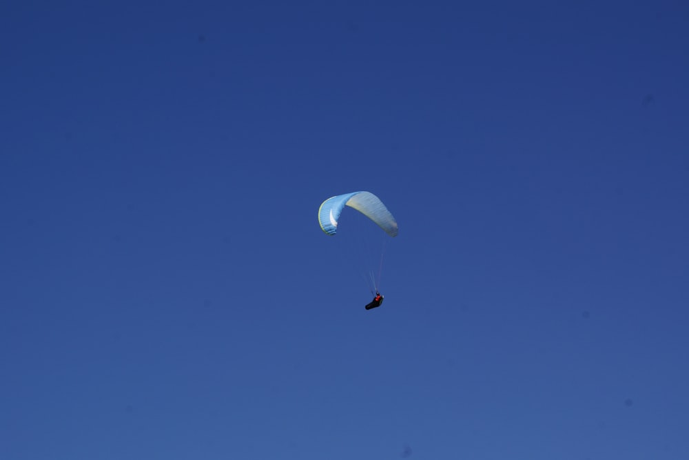 person in red and white parachute