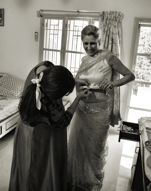Happy Indian woman reviewing documents with a lawyer from Nivaran Trust