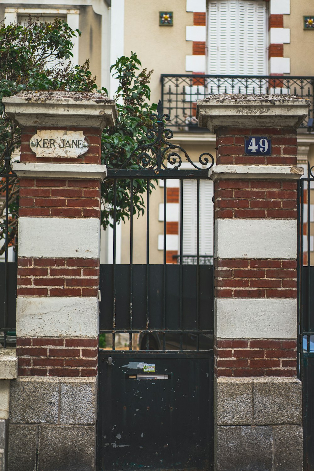 black wooden door on brown brick building