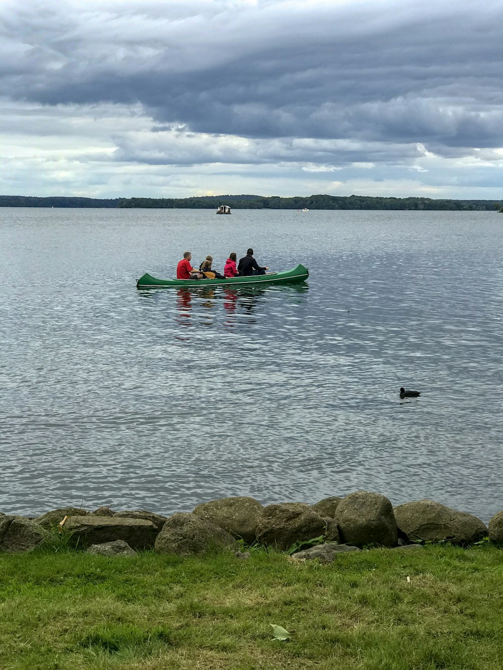 man in red kayak on sea during daytime