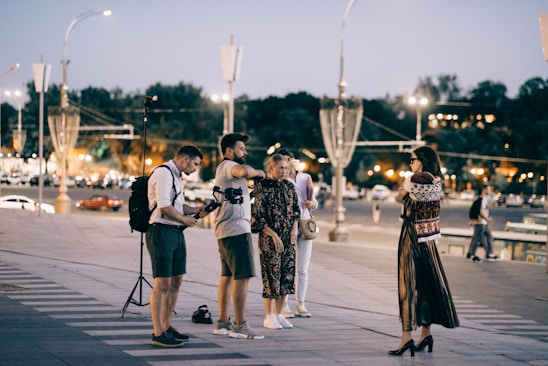 A diverse group of photographers capturing the vibrant streets of a city.