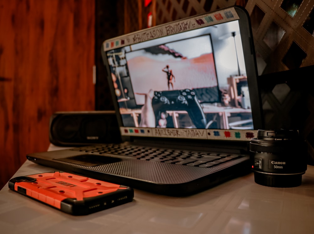 black and silver laptop computer on white table