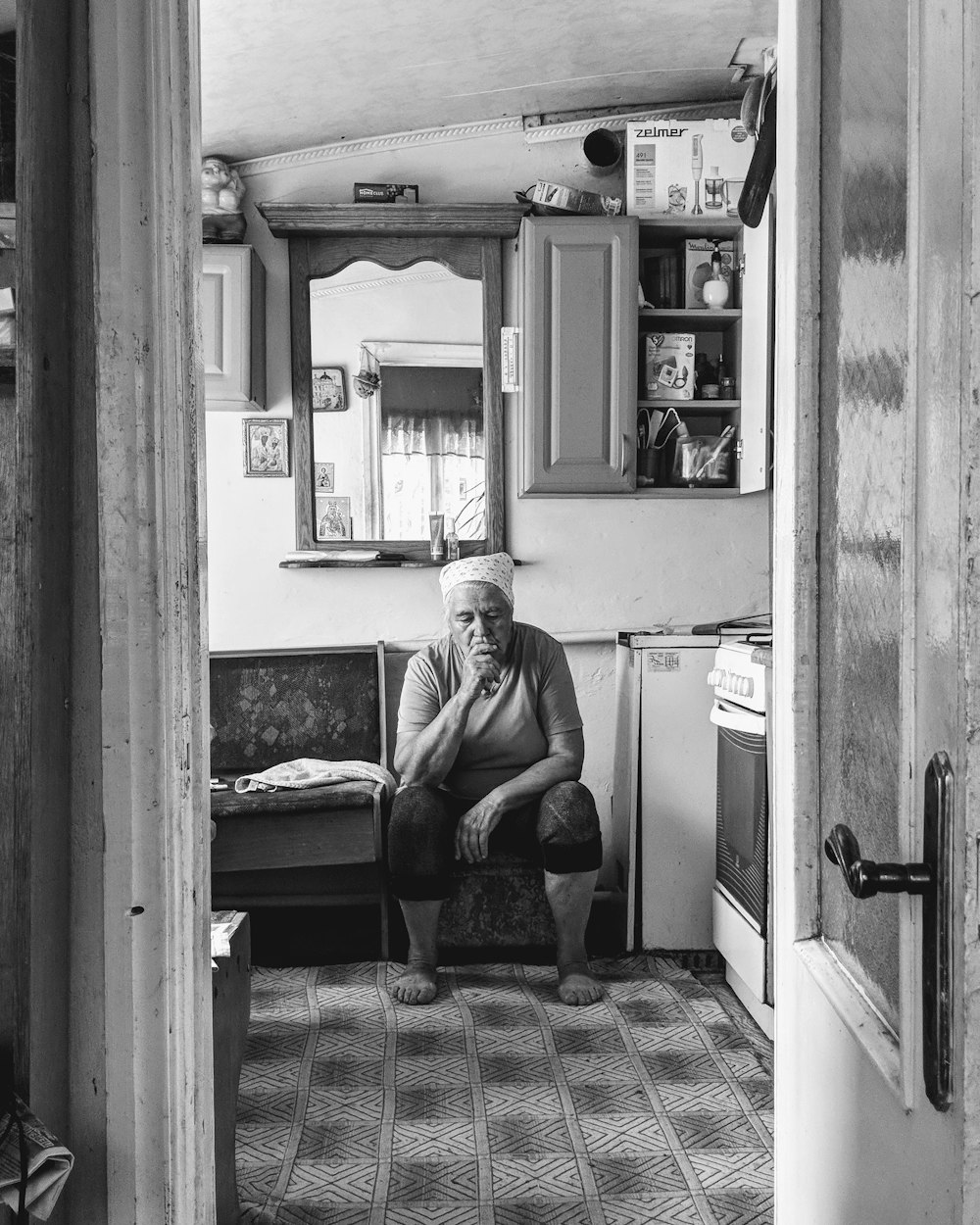 man in black t-shirt sitting on chair