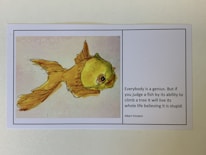An illustration of a goldfish on the left side, accompanied by a quote from Albert Einstein on the right. The quote discusses the idea of judging individuals based on irrelevant criteria.