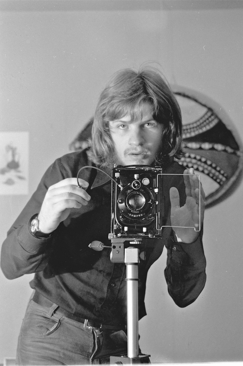 grayscale photo of girl holding camera