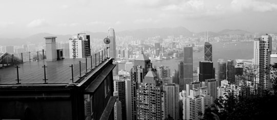 grayscale photo of city buildings in Victoria Peak Hong Kong