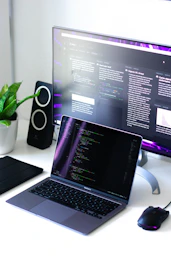 black and silver laptop computer beside black computer mouse