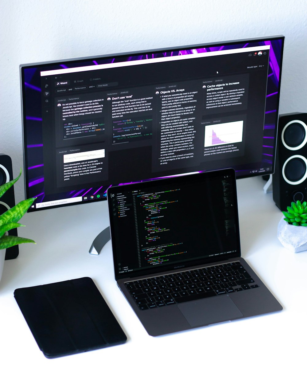 black and silver laptop computer beside black flat screen computer monitor