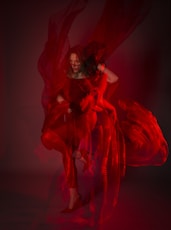 woman in red dress dancing