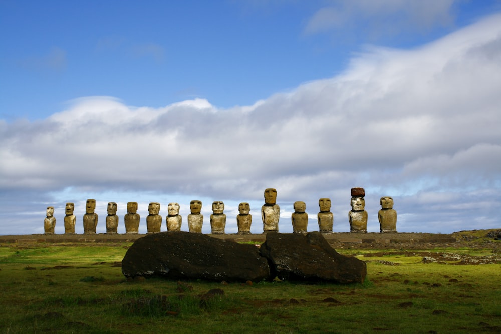 gray rock formation under white clouds and blue sky during daytime