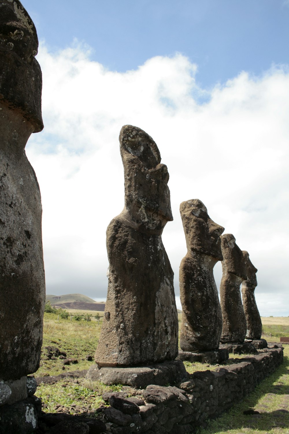 gray rock formation under white clouds during daytime