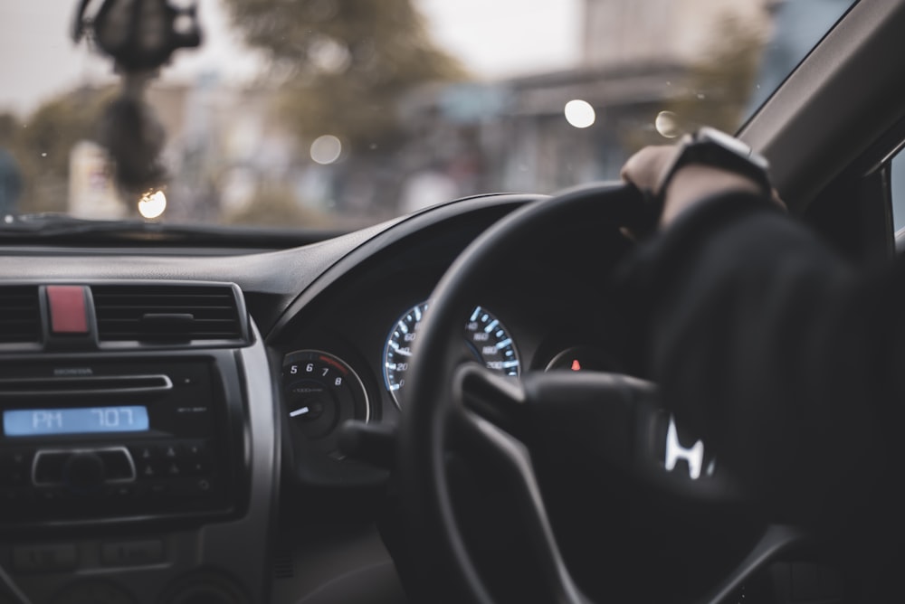 person driving car during daytime