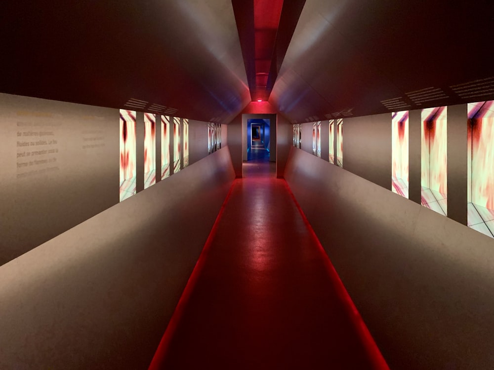 red and white hallway with white and yellow ceiling