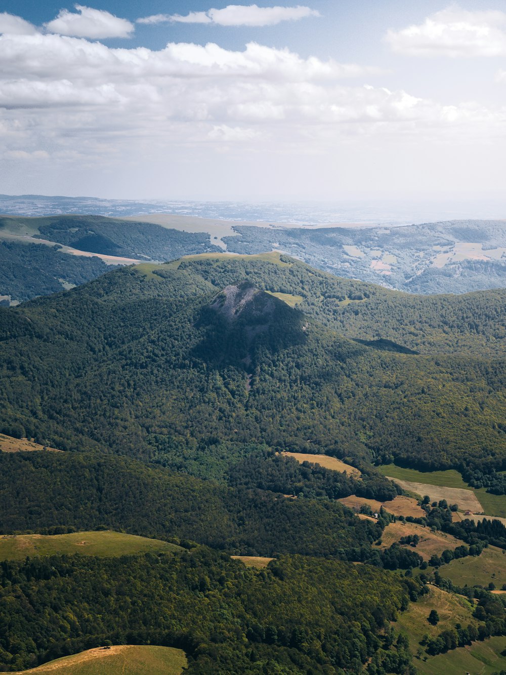 green mountains under white clouds during daytime