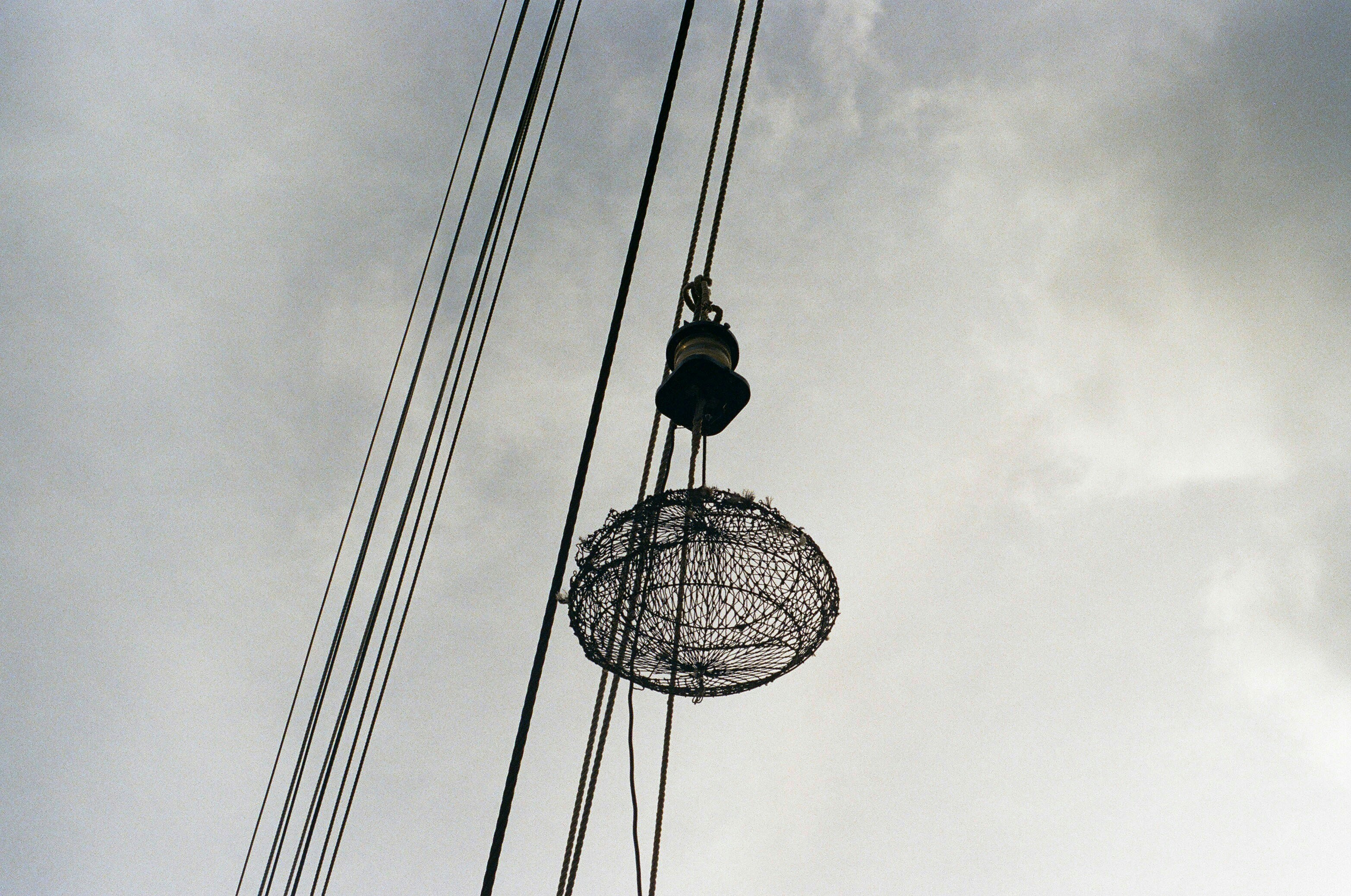 black and white hanging lamp under gray cloudy sky