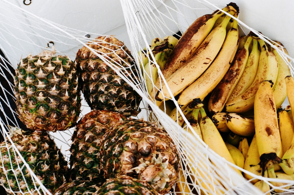 yellow banana fruit on brown woven basket