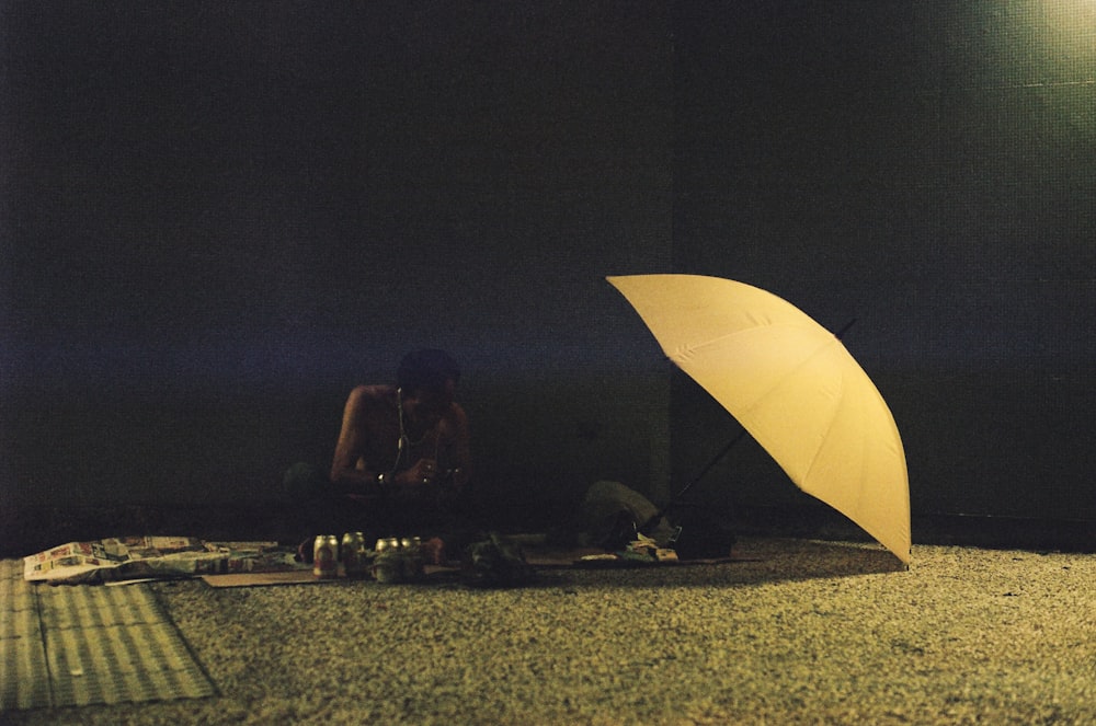 people sitting on the ground during night time