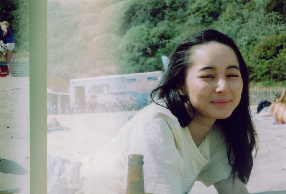 woman in white shirt smiling