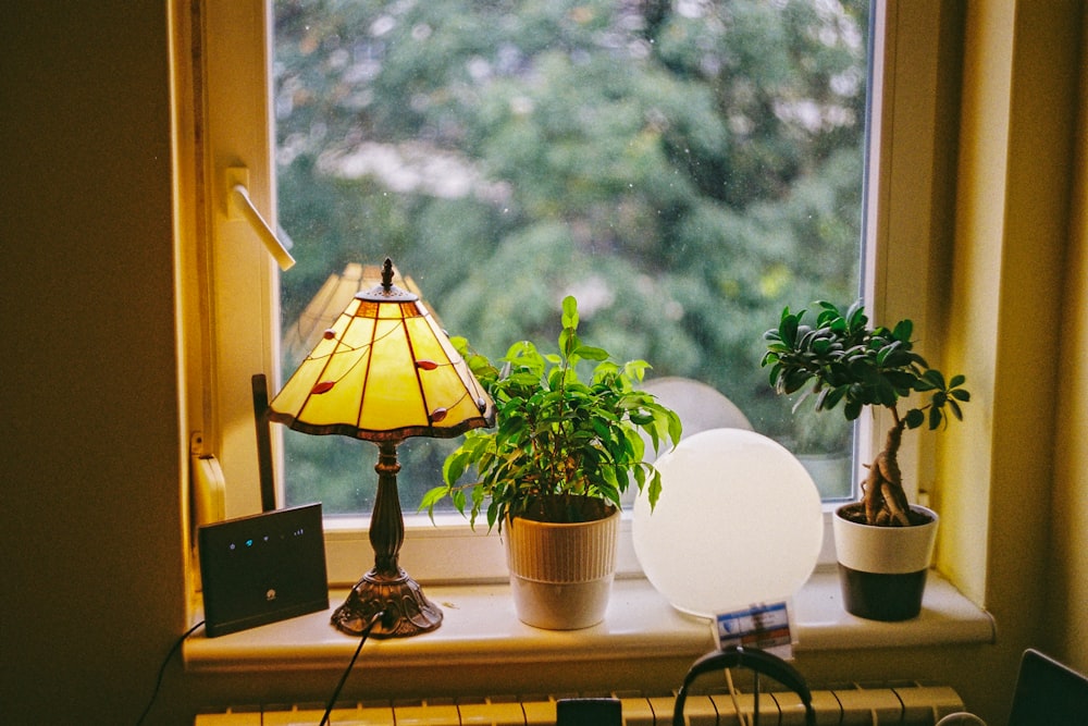 black and brown table lamp on brown wooden table