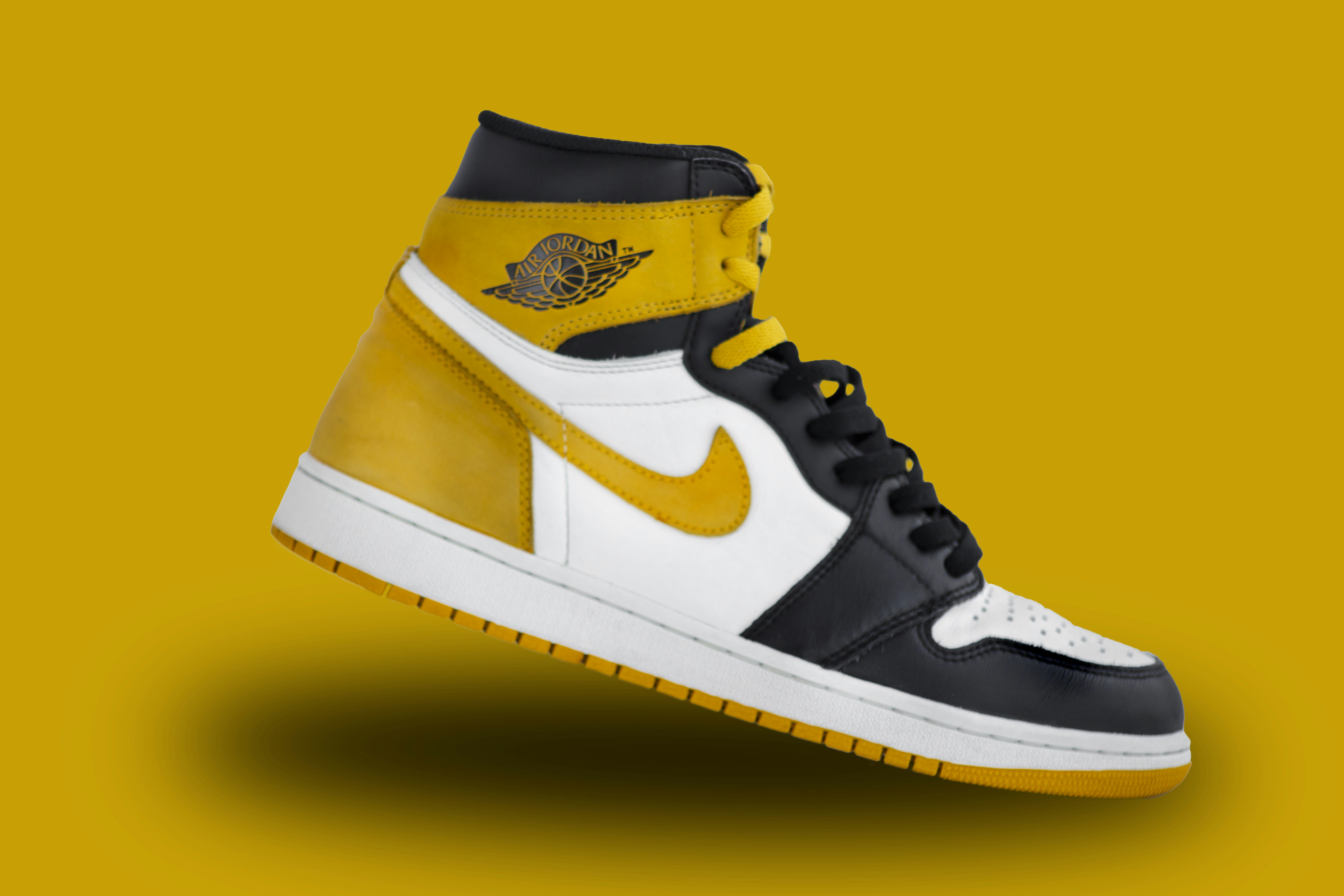 yellow and black high top nike