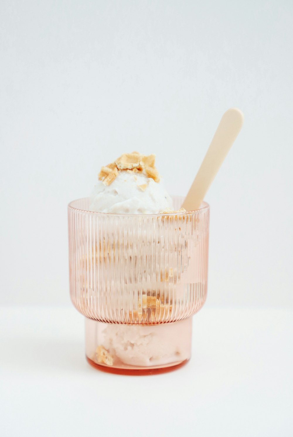 ice cream in cone with white ice cream on top
