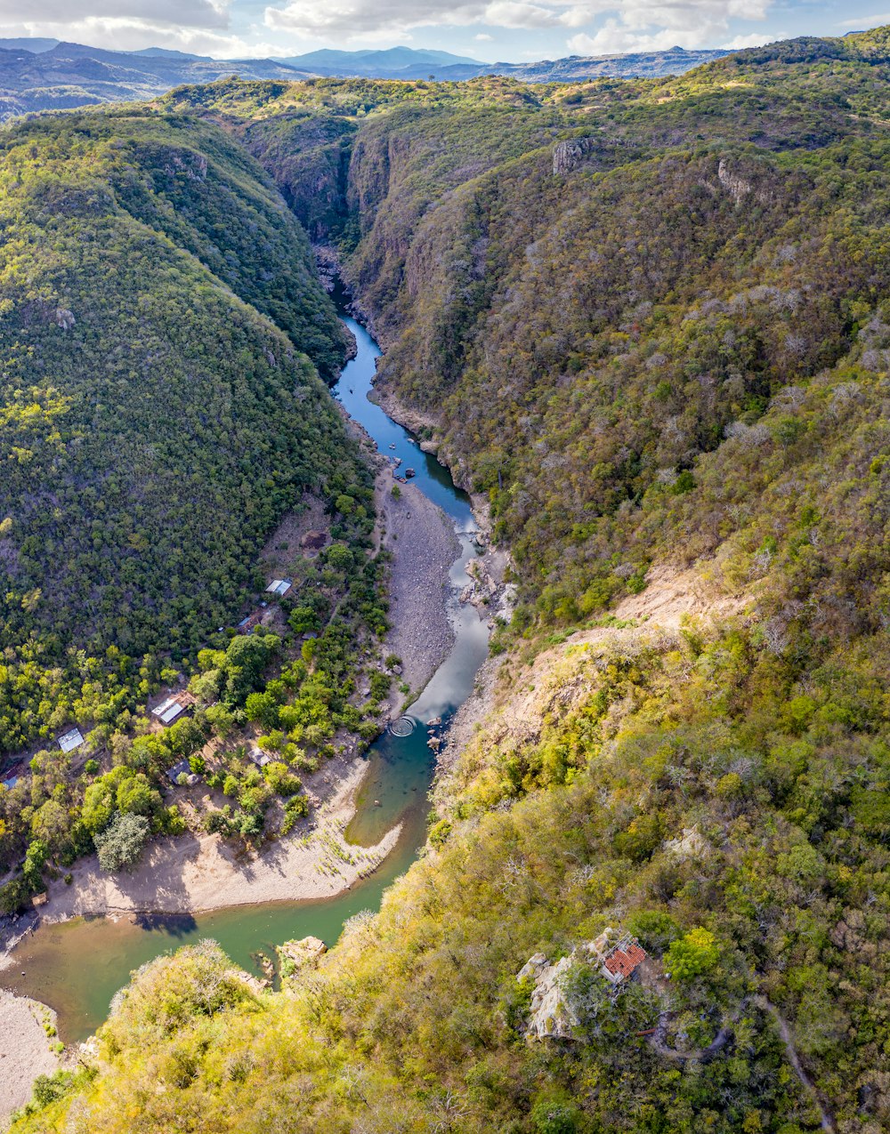 aerial view of green mountains and river