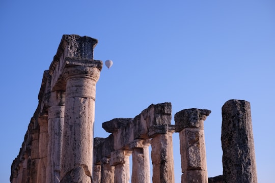 brown concrete building under blue sky during daytime in Hierapolis Turkey