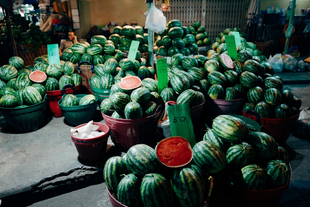 green and red vegetables in red plastic bucket