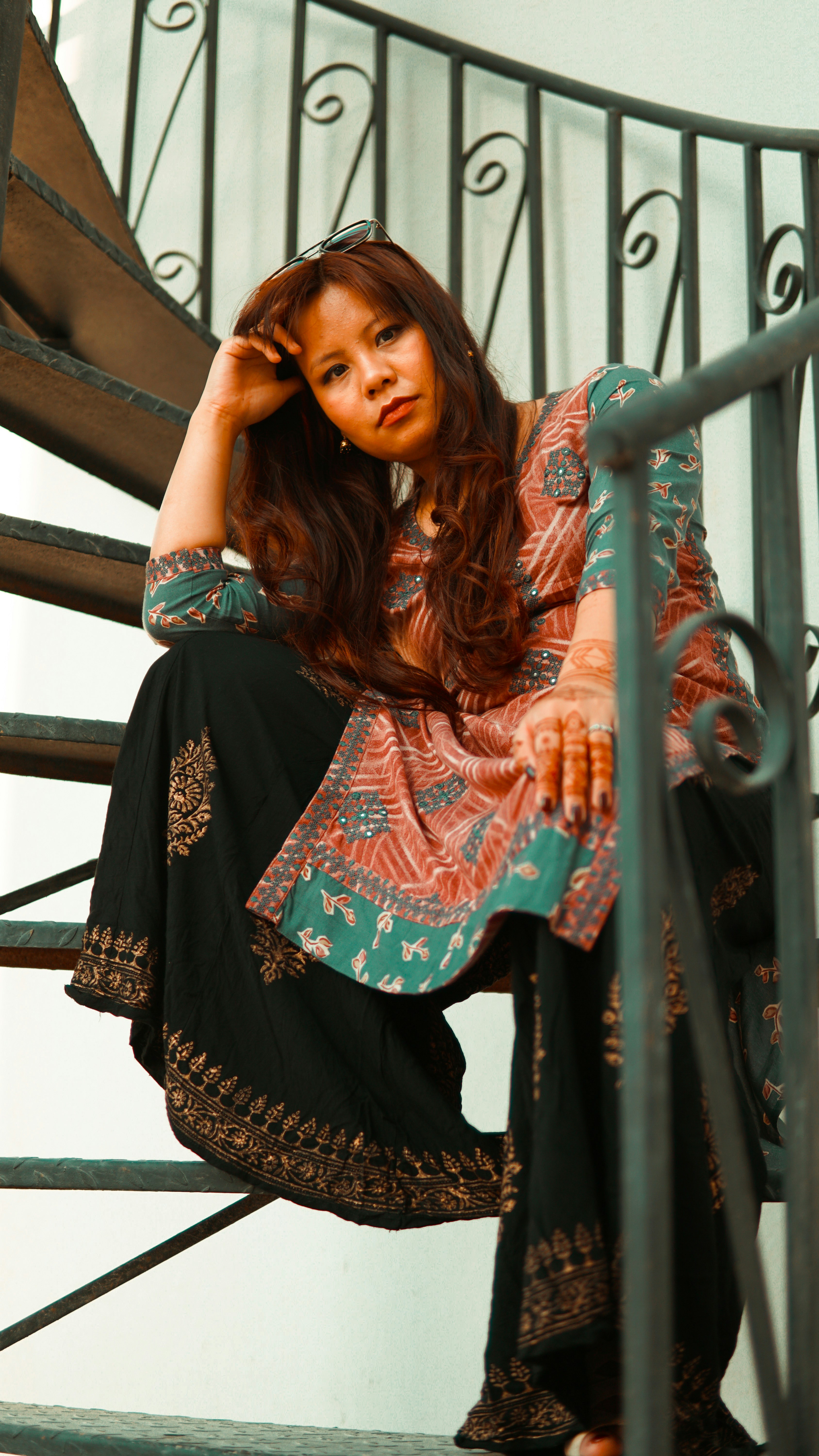 woman in black and pink floral dress