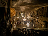 A hidden vampire society meeting in an ancient, dimly lit chamber.