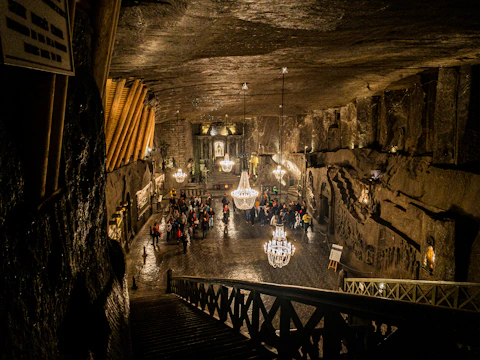 A hidden vampire society meeting in an ancient, dimly lit chamber.