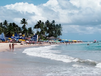 A lively beach scene with people enjoying music.