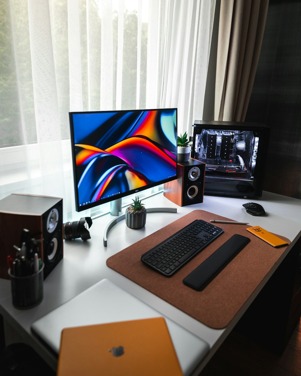 black flat screen computer monitor on white desk