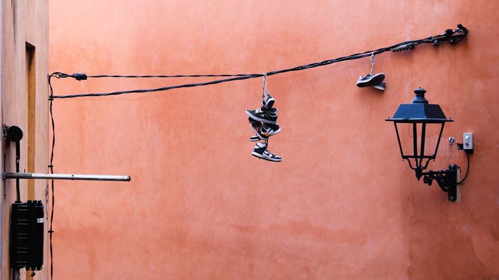 white and black rope on brown wall