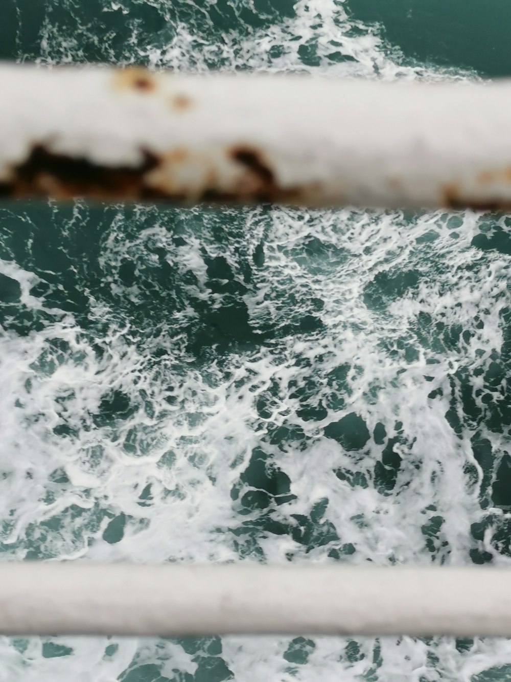 water waves on brown wooden surface