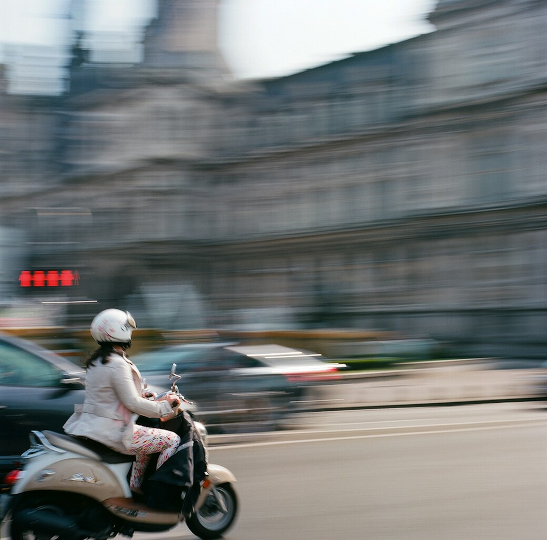 man in black jacket riding motorcycle on road during daytime