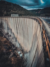 brown wooden bridge over river