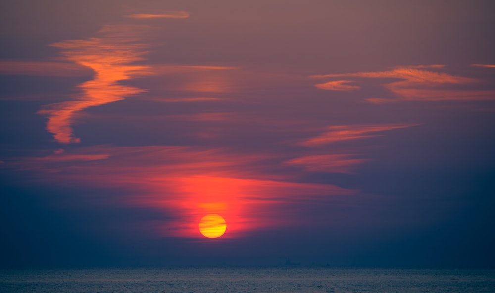 body of water during sunset