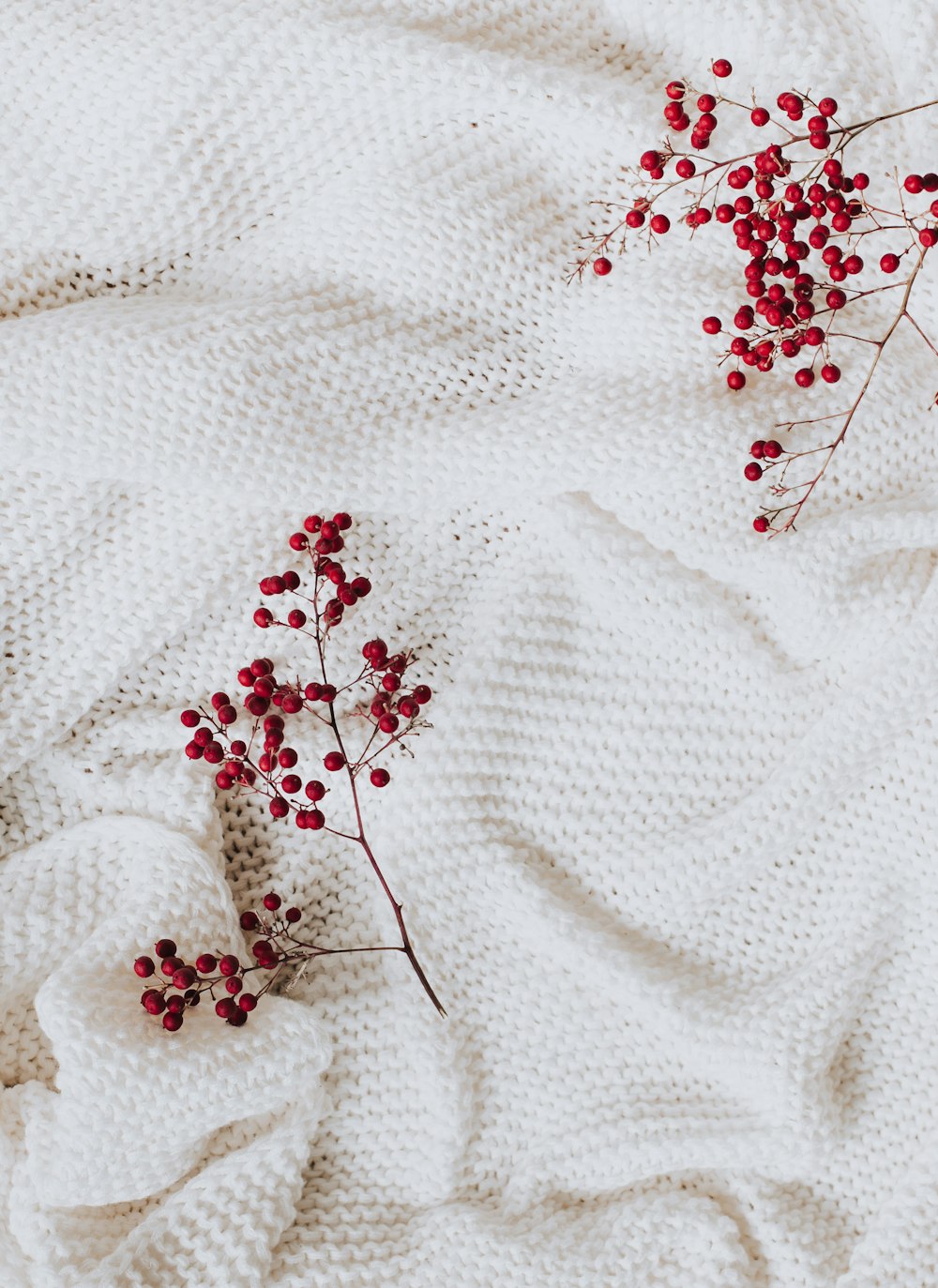 white and red floral textile