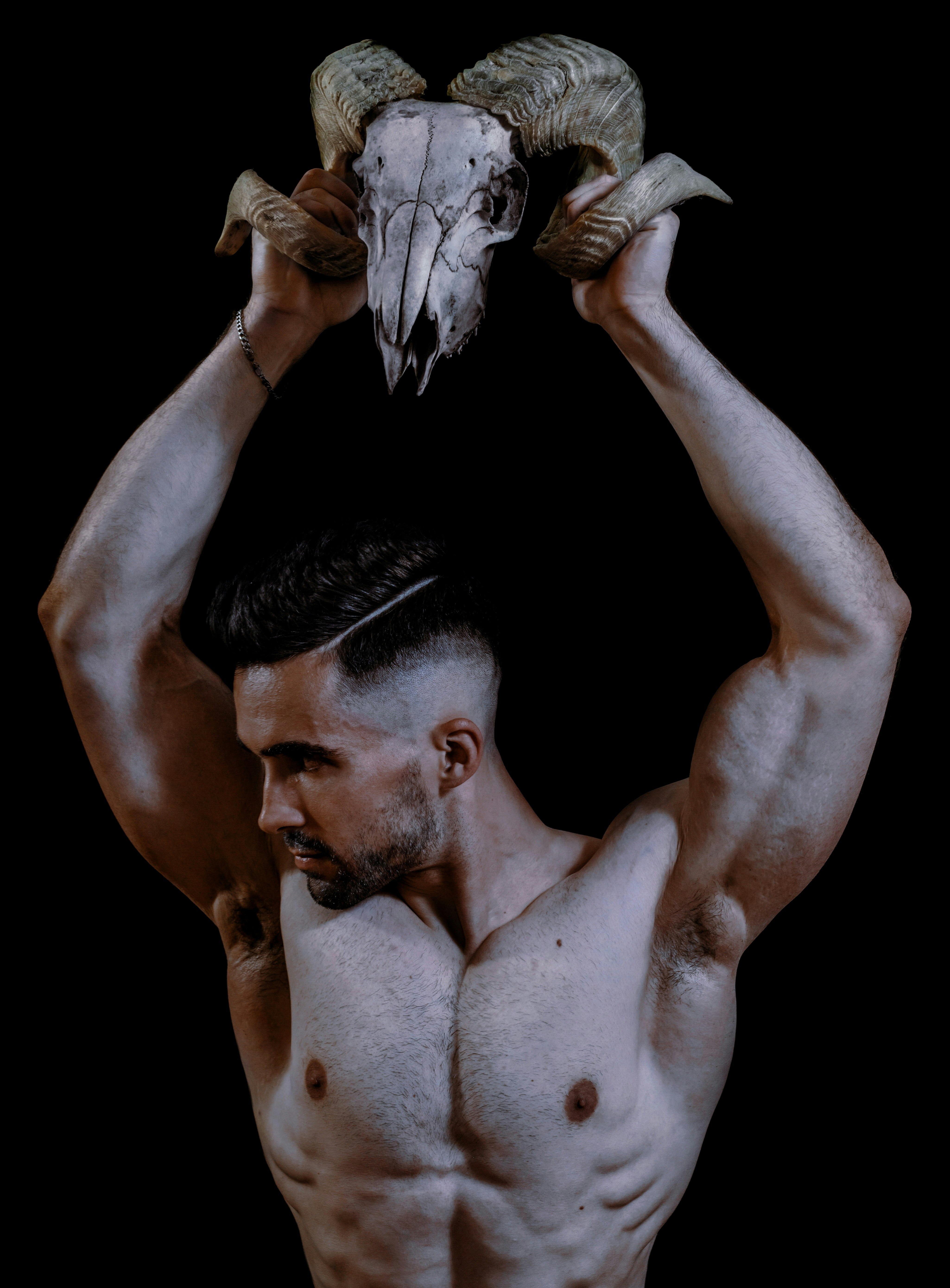 topless man with white wings