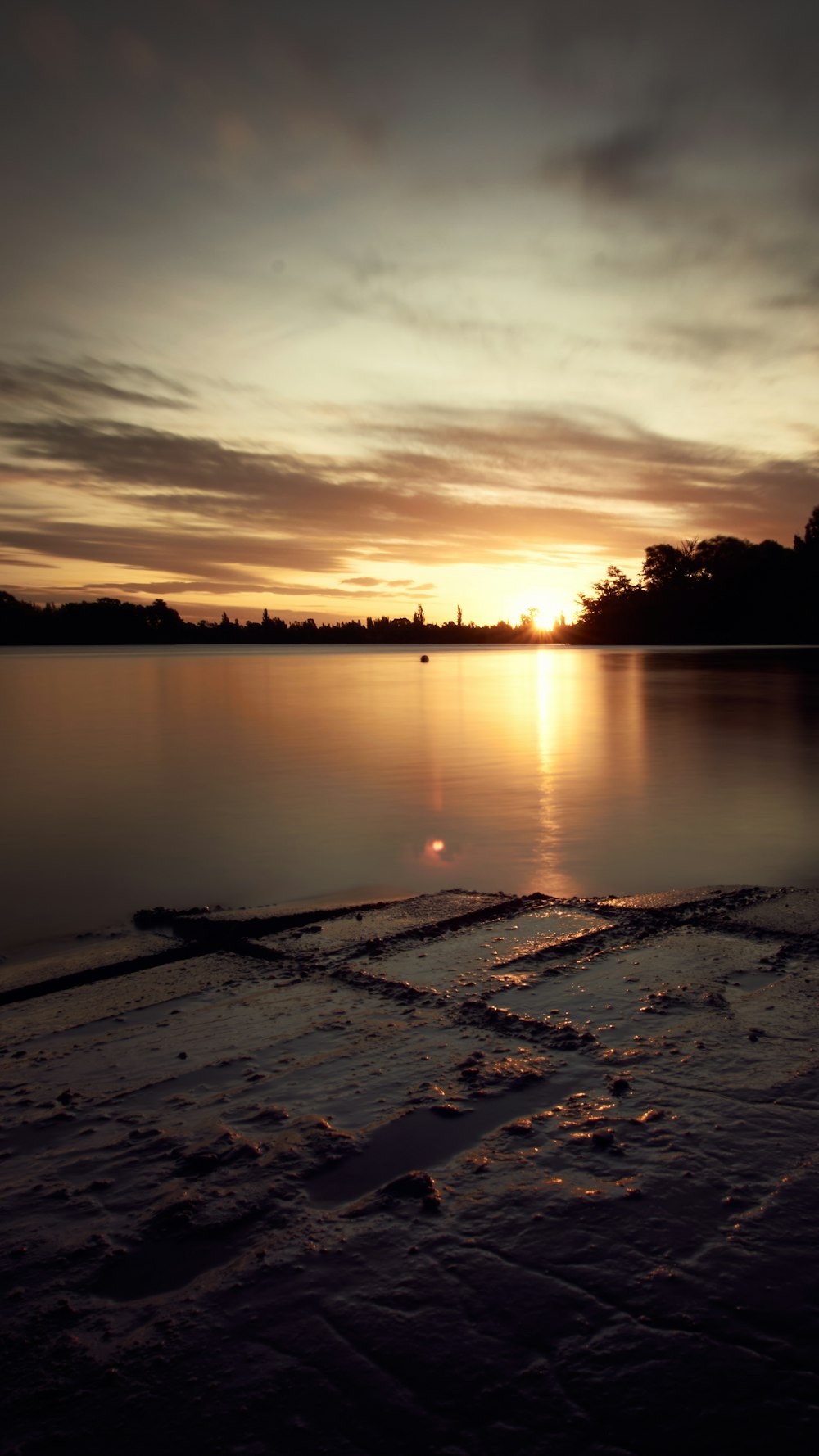 body of water during sunset