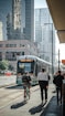 people walking on pedestrian lane near white and red train during daytime