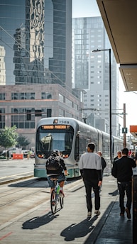 people walking on pedestrian lane near white and red train during daytime