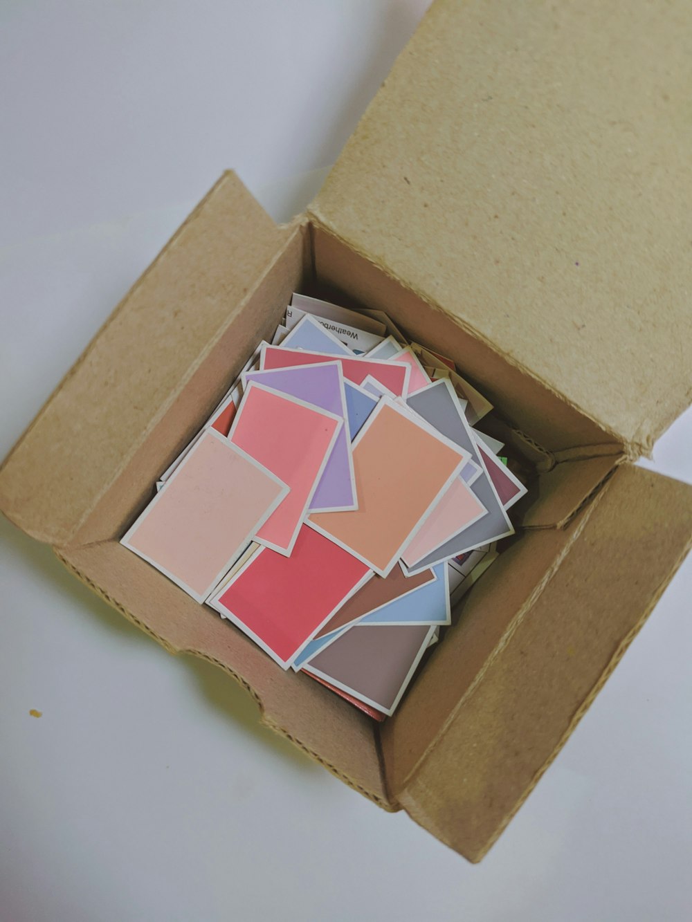 brown cardboard box on white surface