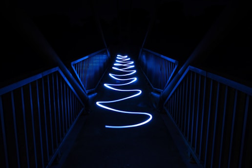 white light on black staircase