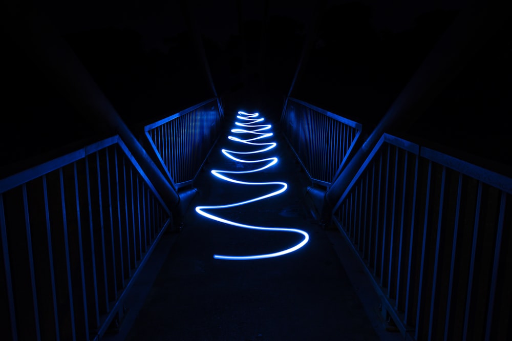 white light on black staircase